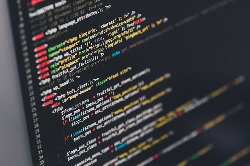 Engineer writing code on a laptop